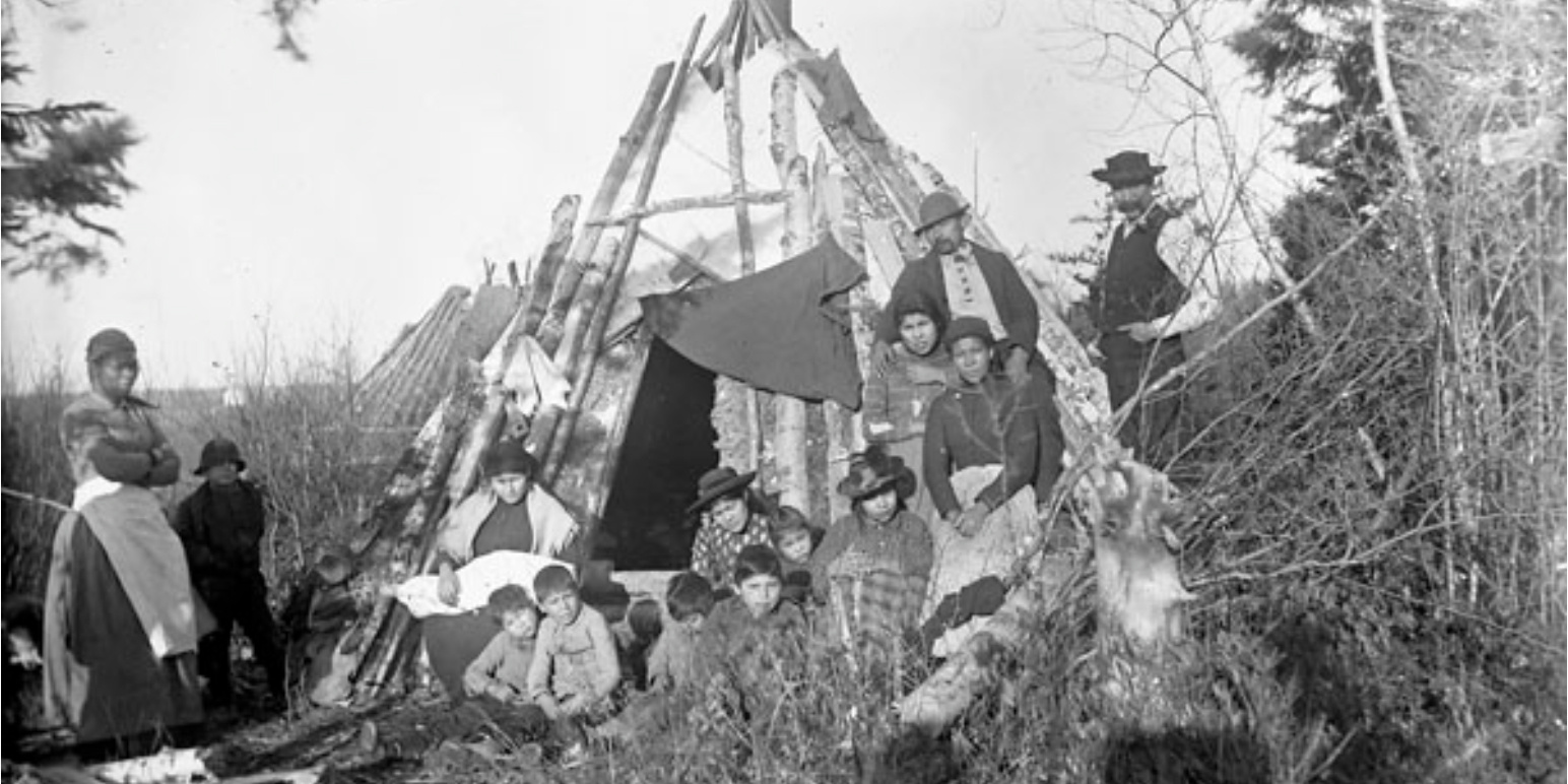 Group of Mi'kmaq in front of a wigwam at their camp in Elmsdale, Nova Scotia. Photo: E.R. Faribault / Geological Survey of Canada / LAC / a039862